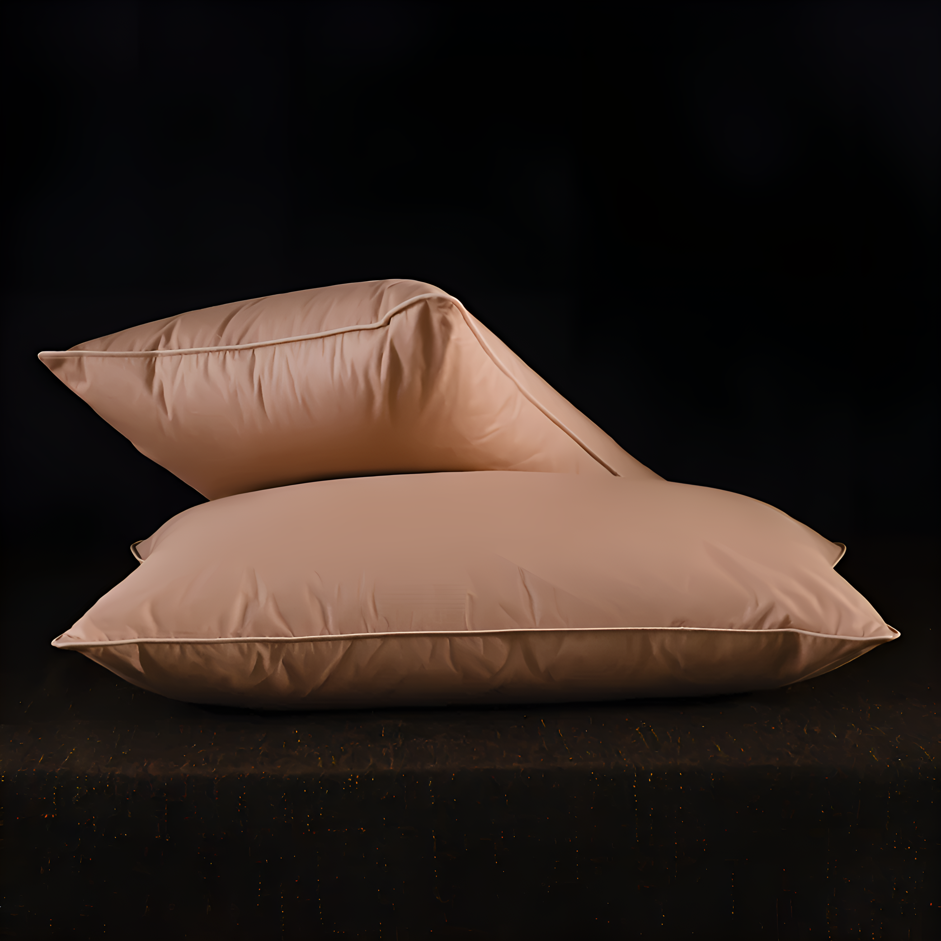 Two beige pillows stacked on a black background
