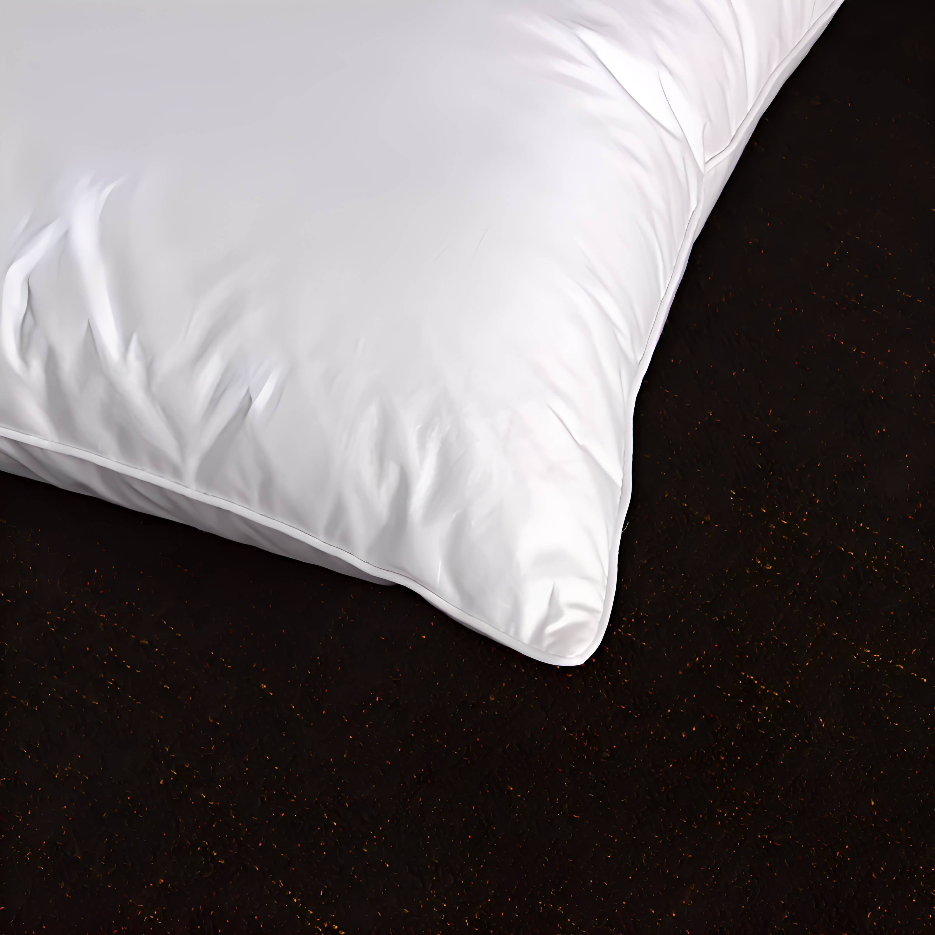 White pillow on a dark surface